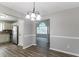 Dining Room and Kitchen View. Gray walls, neutral floors, white trim at 1404 Lancaster Ct, Mcdonough, GA 30252