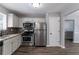 Bright kitchen with stainless steel appliances and eat-in dining area at 1404 Lancaster Ct, Mcdonough, GA 30252