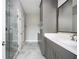 Modern bathroom features marble floors and tile shower at 1947 Drew Nw Dr, Atlanta, GA 30318