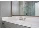 Bathroom with white quartz countertop, gray cabinets, modern fixtures, and a glass-enclosed shower at 1947 Drew Nw Dr, Atlanta, GA 30318