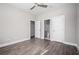 Spacious bedroom featuring new wood flooring, neutral paint, ceiling fan and bright white trim at 1947 Drew Nw Dr, Atlanta, GA 30318