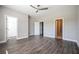 Bedroom with wood floors, three white doors and a ceiling fan at 1947 Drew Nw Dr, Atlanta, GA 30318