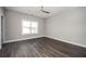 Bedroom with hardwood floors, neutral walls, ceiling fan and bright white trim at 1947 Drew Nw Dr, Atlanta, GA 30318