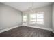 Bright dining area features a modern light fixture, a door to the deck, and views of the neighborhood at 1947 Drew Nw Dr, Atlanta, GA 30318