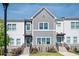 Charming townhome featuring stone accents, landscaped yard, and a welcoming entrance, perfect for modern living at 1947 Drew Nw Dr, Atlanta, GA 30318