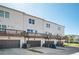 Rear exterior view of the three-story townhomes with private decks above each garage at 1947 Drew Nw Dr, Atlanta, GA 30318