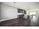 Modern kitchen featuring gray cabinets, stainless steel appliances, and a well-lit island for cooking and dining at 1947 Drew Nw Dr, Atlanta, GA 30318