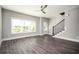 Bright, open living area featuring sleek floors, fresh paint, and an attractive staircase for a modern feel at 1947 Drew Nw Dr, Atlanta, GA 30318