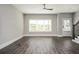 Inviting living room boasting hardwood floors, ample natural light, and a contemporary ceiling fan at 1947 Drew Nw Dr, Atlanta, GA 30318