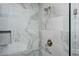 Shower with marble tile, brushed nickel fixtures and custom shelf at 1947 Drew Nw Dr, Atlanta, GA 30318