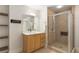 Bright bathroom featuring a glass enclosed shower, a single sink vanity, and tile flooring at 285 Centennial Olympic Park Nw Dr # 809, Atlanta, GA 30313