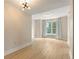 Bright bedroom with wood flooring and large windows providing ample natural light at 285 Centennial Olympic Park Nw Dr # 809, Atlanta, GA 30313