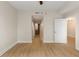 An empty bedroom with neutral walls, light wood floors, and a ceiling fan provides a versatile space at 285 Centennial Olympic Park Nw Dr # 809, Atlanta, GA 30313