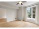 Bedroom with beautiful wood floors, neutral walls, and a large window offering city views at 285 Centennial Olympic Park Nw Dr # 809, Atlanta, GA 30313