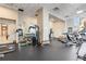 Spacious gym area with modern exercise equipment and a mirrored wall at 285 Centennial Olympic Park Nw Dr # 809, Atlanta, GA 30313