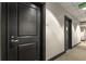Hallway with clean lines, neutral colors, and modern door fixtures at 285 Centennial Olympic Park Nw Dr # 809, Atlanta, GA 30313
