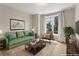 Staged living room featuring comfortable seating, a large window, and stylish decor at 285 Centennial Olympic Park Nw Dr # 809, Atlanta, GA 30313
