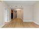 An open-concept living space showcasing hardwood floors, neutral walls, and ample natural light at 285 Centennial Olympic Park Nw Dr # 809, Atlanta, GA 30313