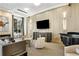 Relax in this cozy lounge with comfortable seating, a large TV, and a piano at 285 Centennial Olympic Park Nw Dr # 809, Atlanta, GA 30313