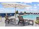 Beautiful rooftop pool area with lounge chairs, umbrellas, and city views at 285 Centennial Olympic Park Nw Dr # 809, Atlanta, GA 30313