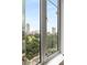 Enjoy this window view of green trees and the city at 285 Centennial Olympic Park Nw Dr # 809, Atlanta, GA 30313