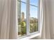 A bright window frames a view of the city skyline and green space, creating a pleasant, airy atmosphere at 285 Centennial Olympic Park Nw Dr # 809, Atlanta, GA 30313