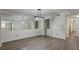 Open concept dining area with wood floors, decorative light fixture, and washer/dryer at 6851 Roswell Rd # G20, Sandy Springs, GA 30328