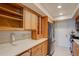 Bright galley kitchen with modern appliances and wooden cabinets providing ample storage space at 6851 Roswell Rd # G20, Sandy Springs, GA 30328