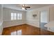 Living room with rich hardwood floors, decorative wall paneling, and ample natural light at 6851 Roswell Rd # G20, Sandy Springs, GA 30328