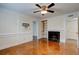 Spacious living room featuring hardwood floors, fireplace and tv mount at 6851 Roswell Rd # G20, Sandy Springs, GA 30328