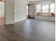 Sunlit living room features wood floors, a bay window with a seat and neutral walls at 6851 Roswell Rd # G20, Sandy Springs, GA 30328