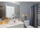 Compact bathroom features a neutral color scheme with a combination shower and bathtub at 739 E Mays E Rd, Stockbridge, GA 30281