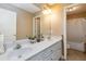 Bright bathroom with double sinks, white cabinets, and a shower-tub combination at 739 E Mays E Rd, Stockbridge, GA 30281