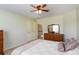 Relaxing bedroom featuring a ceiling fan and traditional furnishings with carpet floors at 739 E Mays E Rd, Stockbridge, GA 30281