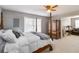 This bedroom features a four-poster bed and a cozy sitting area with leather furniture at 739 E Mays E Rd, Stockbridge, GA 30281