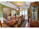 Elegant dining room features traditional décor, an archway leading to the foyer, and large windows at 739 E Mays E Rd, Stockbridge, GA 30281