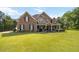 Beautiful home exterior with brick and siding, featuring a large front lawn at 739 E Mays E Rd, Stockbridge, GA 30281