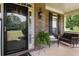 Inviting front porch features brick accents, a porch swing, and decorative details at 739 E Mays E Rd, Stockbridge, GA 30281