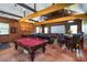 Large game room with a pool table, shuffleboard, home theater, and comfortable seating at 739 E Mays E Rd, Stockbridge, GA 30281