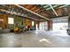 Interior view of a spacious detached garage with high ceilings and equipment at 739 E Mays E Rd, Stockbridge, GA 30281