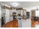 Bright eat-in kitchen with white cabinets, stainless appliances, and dark countertops at 739 E Mays E Rd, Stockbridge, GA 30281