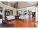 Bright living room with hardwood floors, high ceilings, and seamless flow to the dining and kitchen areas at 739 E Mays E Rd, Stockbridge, GA 30281