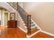 Stairway with wood and iron details, and beautiful hardwood flooring at 739 E Mays E Rd, Stockbridge, GA 30281
