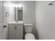 Contemporary half bath featuring a new vanity, modern light fixture, and neutral wall color at 740 Stoneside Ct, Stone Mountain, GA 30083