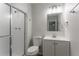 Neutral bathroom featuring a glass shower, vanity with storage, and modern fixtures and a white toilet at 740 Stoneside Ct, Stone Mountain, GA 30083