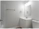 Clean bathroom with neutral tile, white vanity, and modern fixtures at 740 Stoneside Ct, Stone Mountain, GA 30083