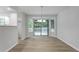 Dining area with hardwood floors, bay window and sliding glass door to outdoor deck at 740 Stoneside Ct, Stone Mountain, GA 30083