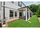 Cozy covered back patio with outdoor seating, perfect for relaxing and enjoying the backyard view at 1399 Flathead River Ln, Marietta, GA 30064