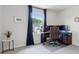 Bright, airy bedroom with a large window, a desk with computer monitors, and tasteful decor at 1399 Flathead River Ln, Marietta, GA 30064