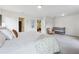 Bright and airy bedroom featuring a crib, reading chair, large windows, and a plush king bed at 1399 Flathead River Ln, Marietta, GA 30064
